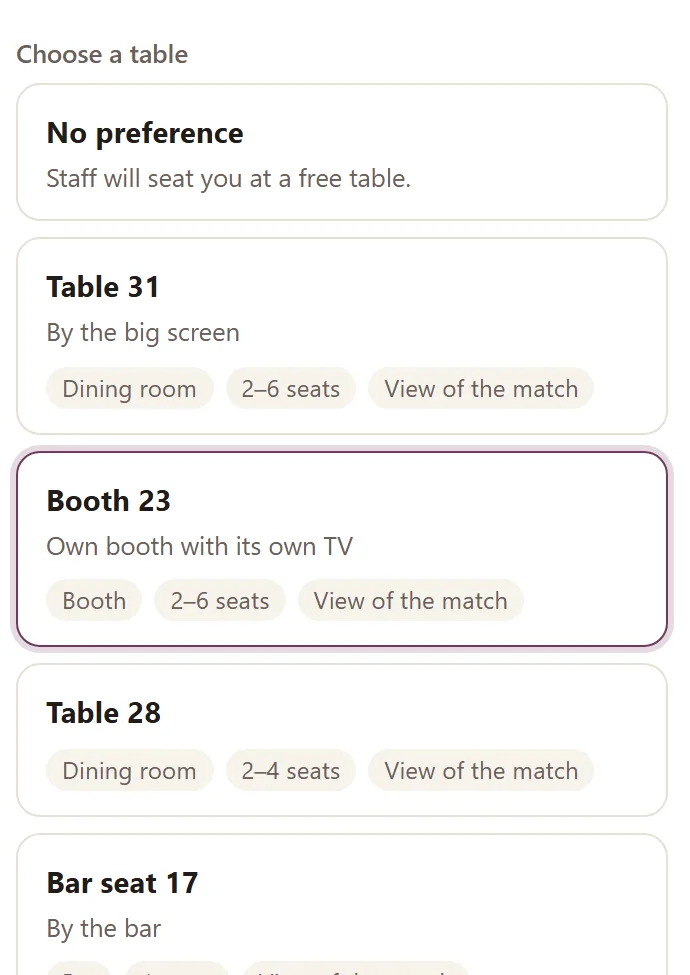 The guest's table list with Booth 23 chosen — a plum highlight around the booth with its own TV, 2–6 seats and view of the match, the demo venue's real view