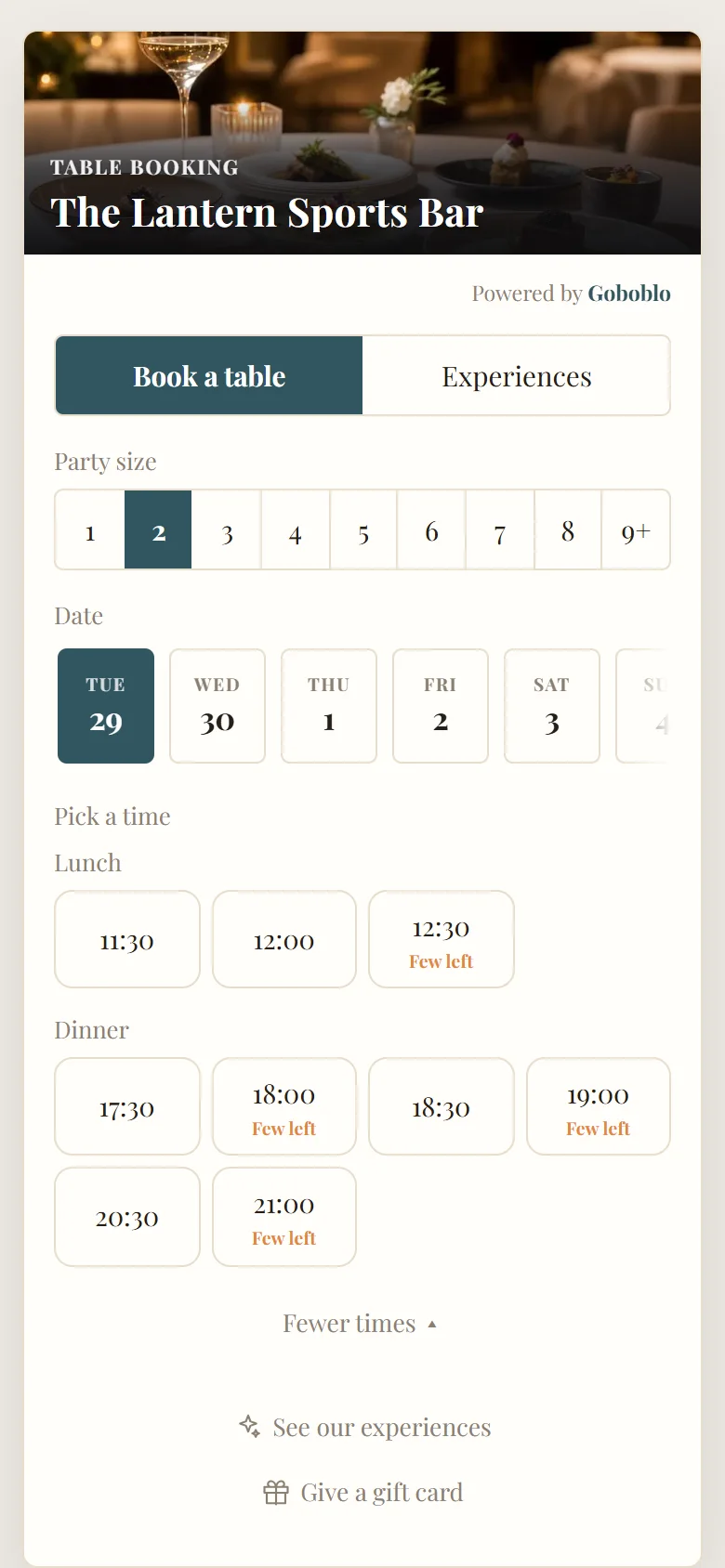 The booking widget in the Elegant theme with a teal accent and a photo of a set table, lunch and dinner times (demo)